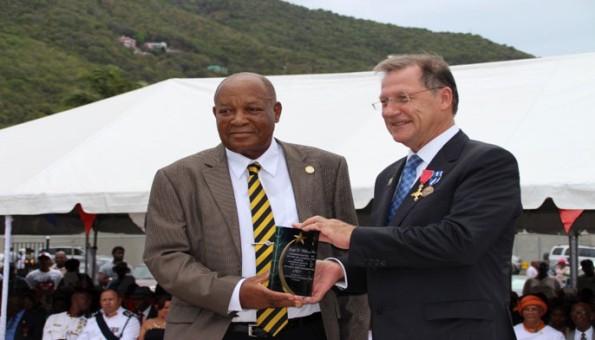 His Excellency John S. Duncan presents Mr. Joseph E. Williams with an award for his royal service.